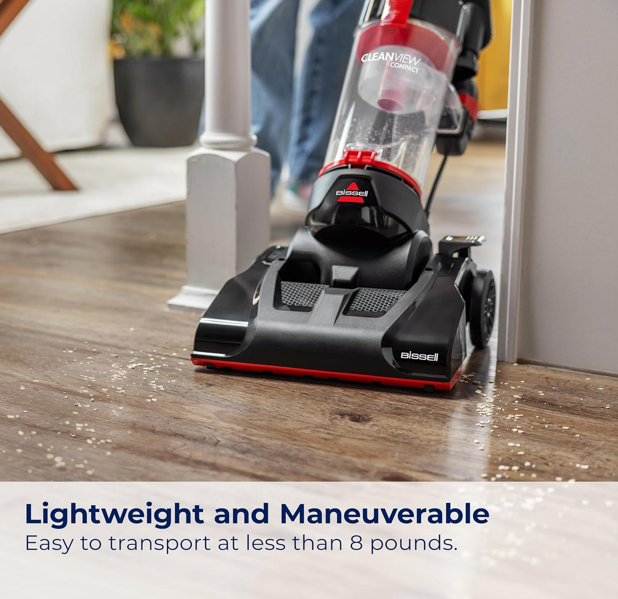 BISSELL CleanView Compact Upright Vacuum standing with cleaning attachments